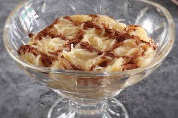 Portuguese vermicelli pudding on a glass bowl