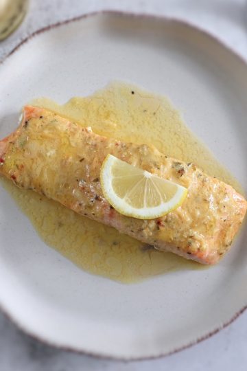 Easy baked salmon with lemon and mustard sauce on a plate