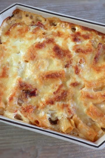 Baked pasta with tuna and ham on a baking dish